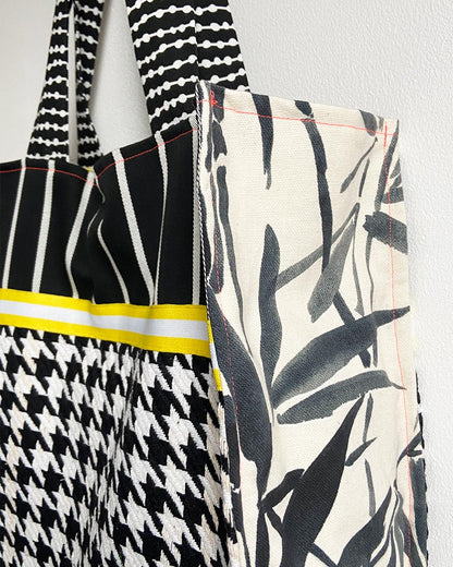unieke, handgemaakte en stevige boodschappentas van PIEKS creations in zwart wit met geel accent - zijkant